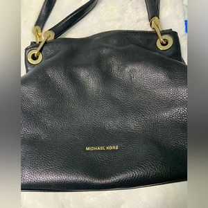 Michael Kors Black Multi Million compartment handbag.